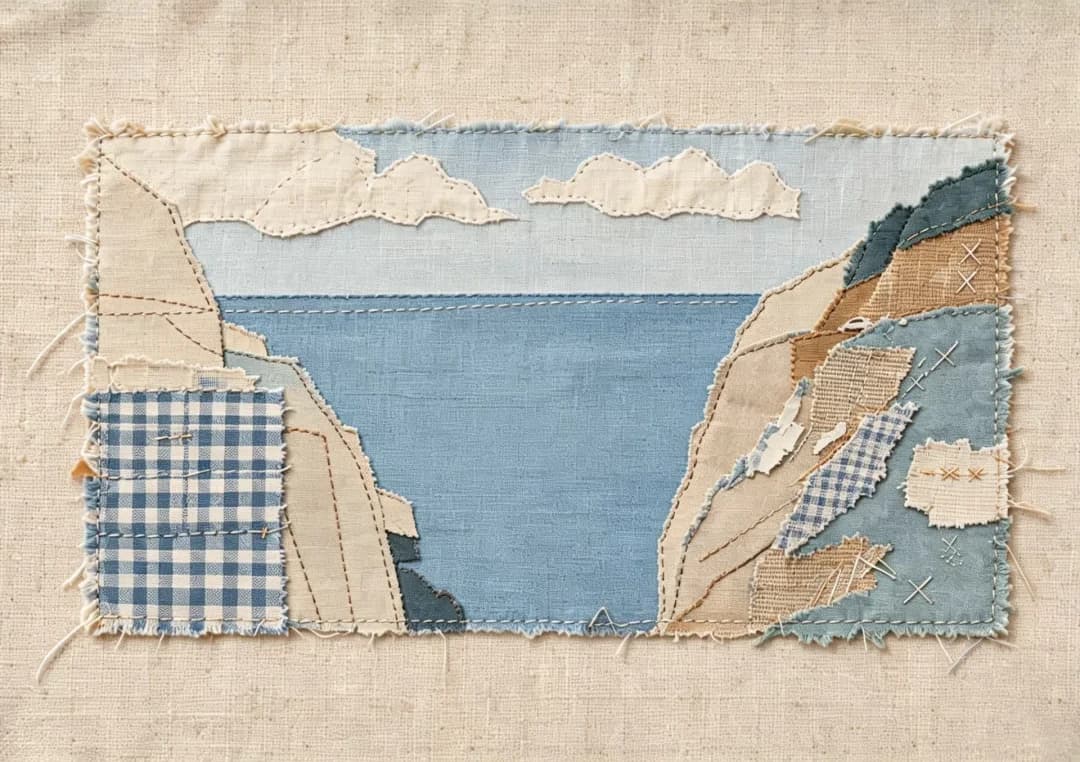 Two rock faces become a single dark V, with the open sea left as one uninterrupted piece of washed denim.